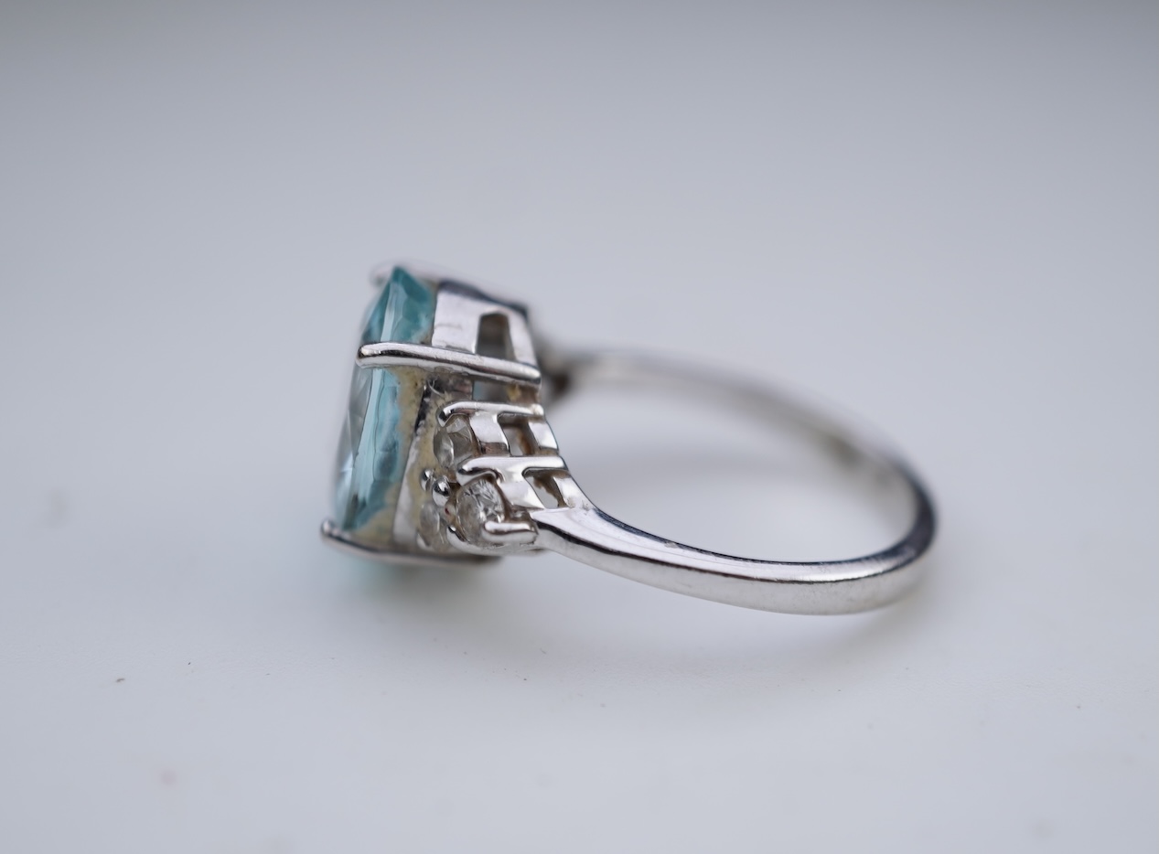 An aquamarine and diamond ring